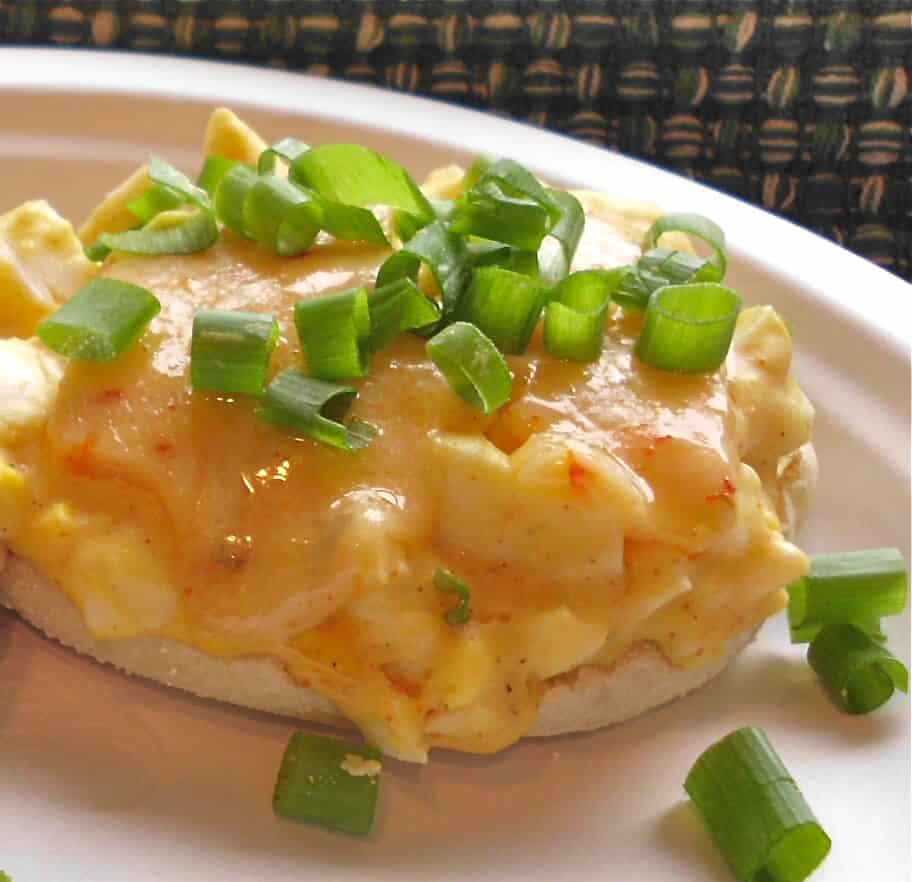 A spicy Egg Salad Sandwich on an English Muffin.
