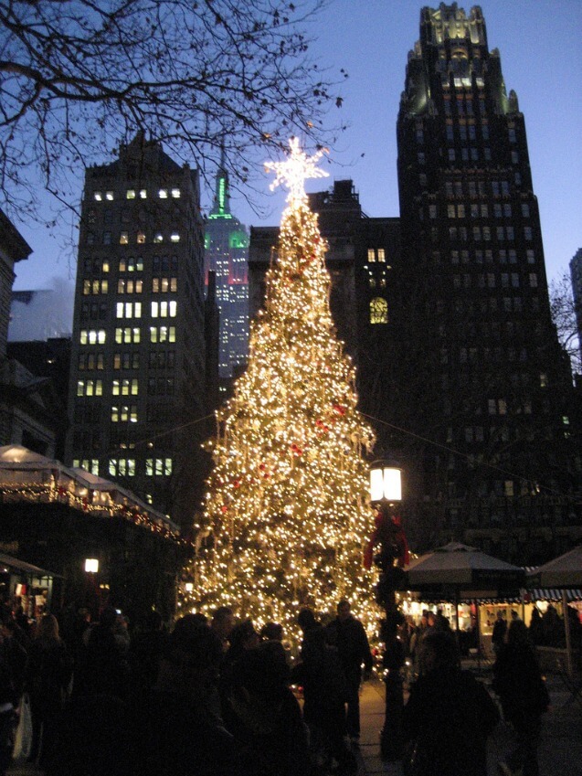 Christmas Tree at Bryant Park in NYC with Empire State Building in the background.