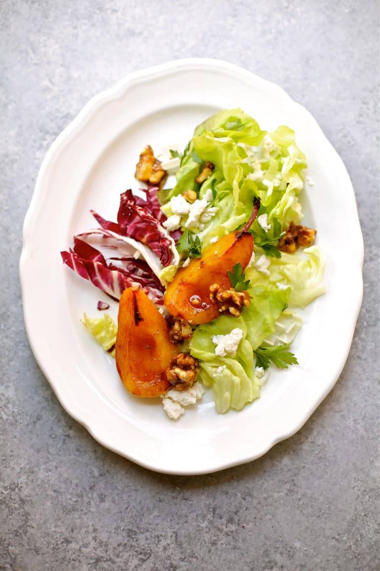Overhead photo of white platter with a Pan Roasted Pear Salad