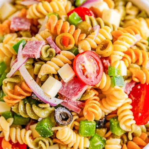 Overhead view of Tri Color Rotini Pasta Salad in a white bowl.