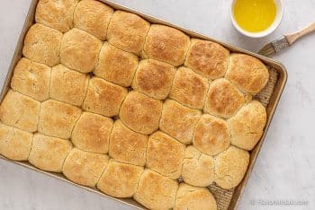 Brush the tops of the biscuits with melted butter.