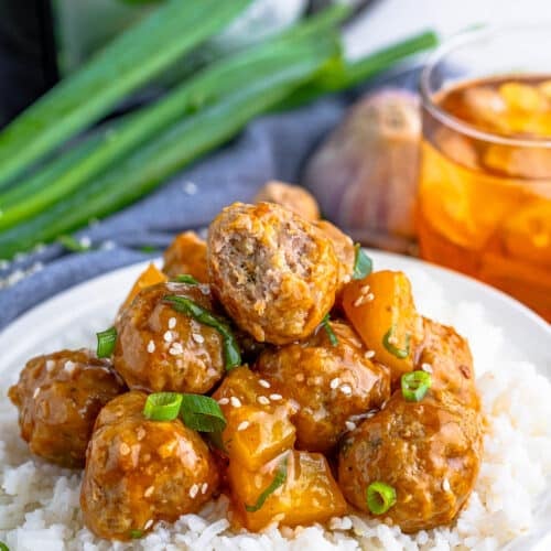 A white plate of Slow Cooker Asian Style Meatballs.