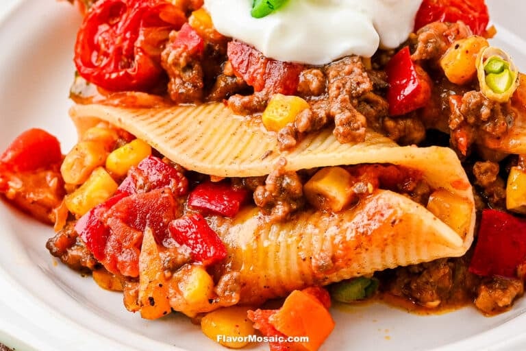 Pasta Shell stuffed with taco meat, crushed tomatoes, corn, and topped with sour cream.