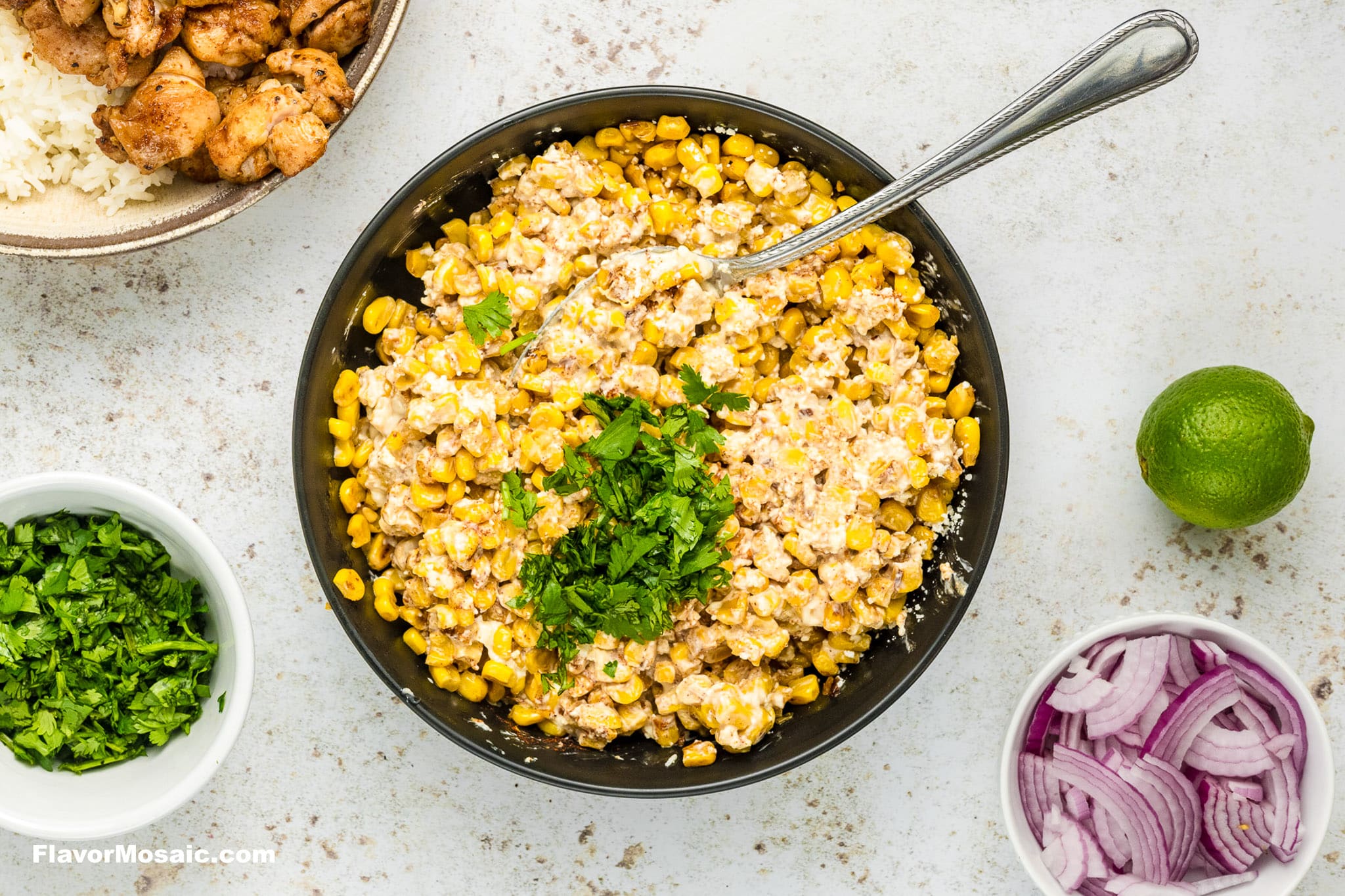 Making street corn in a black bowl.