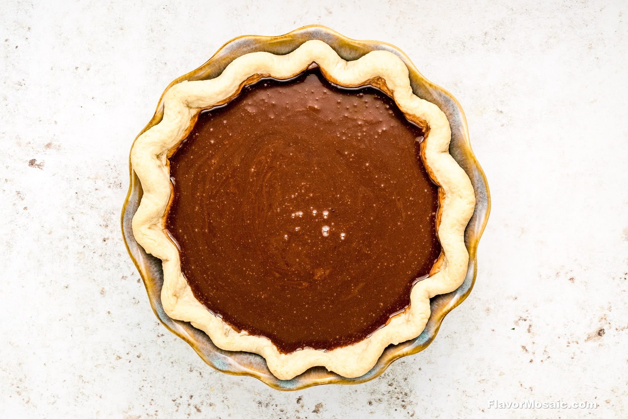 step 7 - Overhead view of unbaked chocolate chess pie before baking.